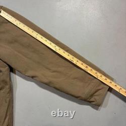 Manteau de gamme Patagonia en toile rétro, veste de grange en tan, doublée en quilt. Manteau de gamme Patagonia en toile rétro, veste de grange en tan, doublée en quilt.